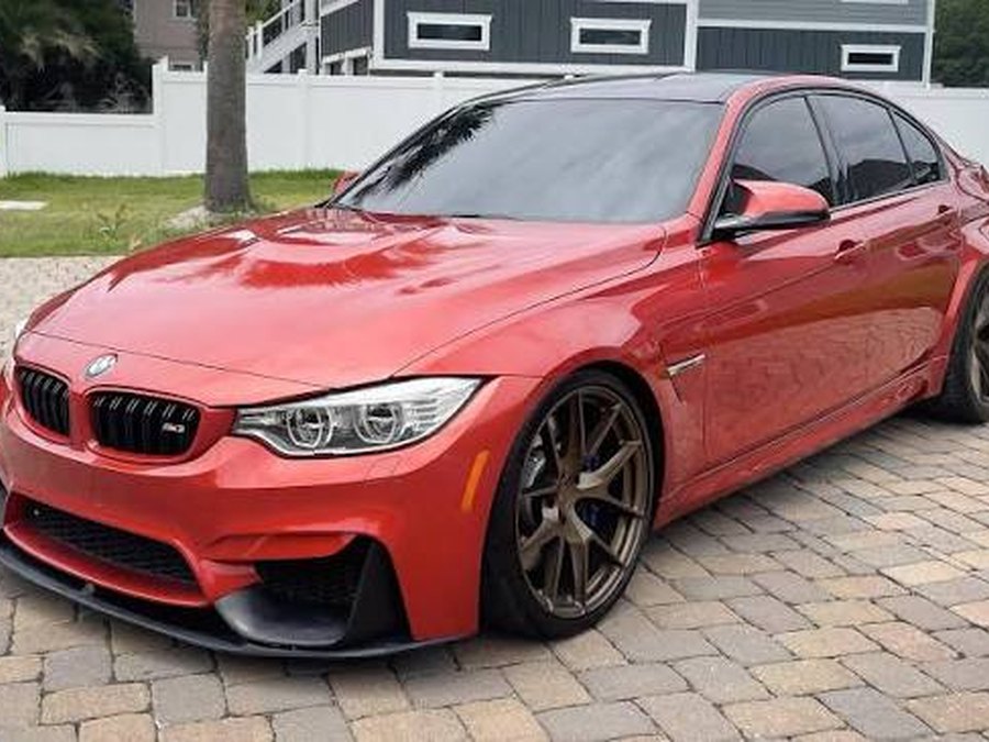 Red performance sedan exterior photo